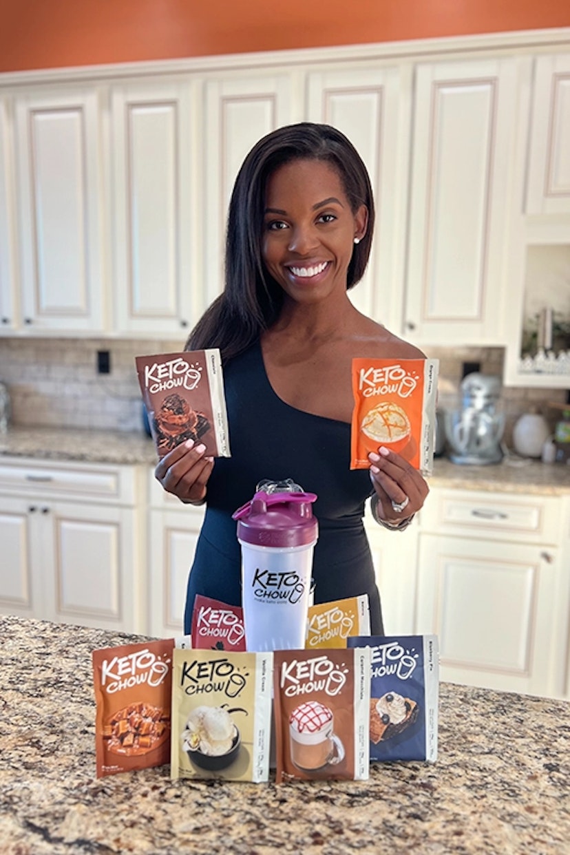 a woman holding bags of keto chow