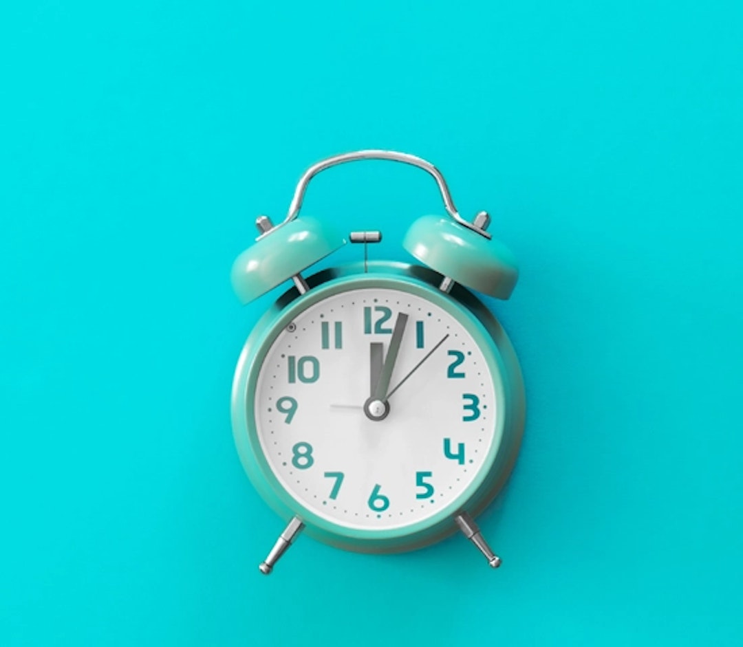 An alarm clock on a blue background