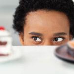 person looking at cake and salmon