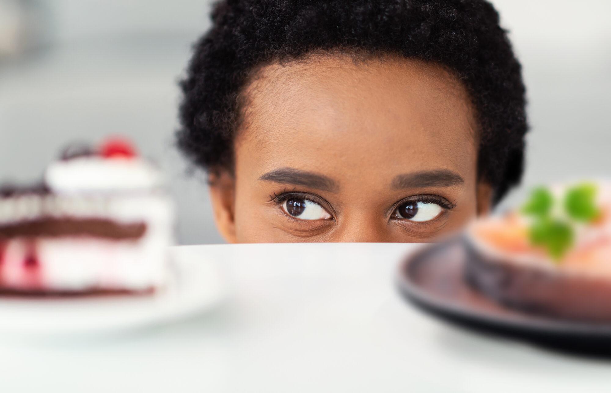 person looking at cake and salmon