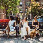 women sitting on bench