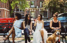 women sitting on bench