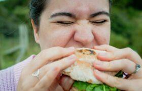 woman eating a sandwich